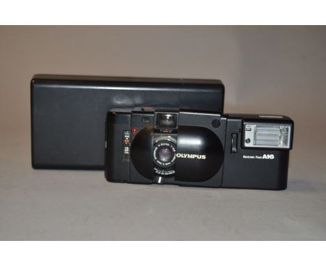 An Olympus XA Compact Rangefinder Camera, black, serial no 3611736, shutter working, condition G, with A16 electronic flash, 