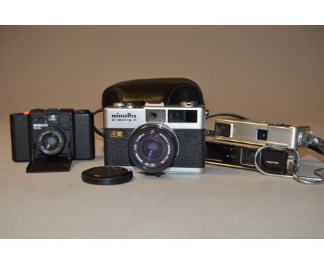 A Group of Compact Film Cameras, a Minolta Hi-Matic F rangefinder camera, serial no 1195453, with Rokkor 38mm f/2.7 lens and 