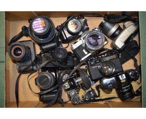 A Group of Japanese 35mm SLR Cameras, including Canon, Chinon, Konica, Minolta and Olympus plus a Yashica Electro 35 Rangefin