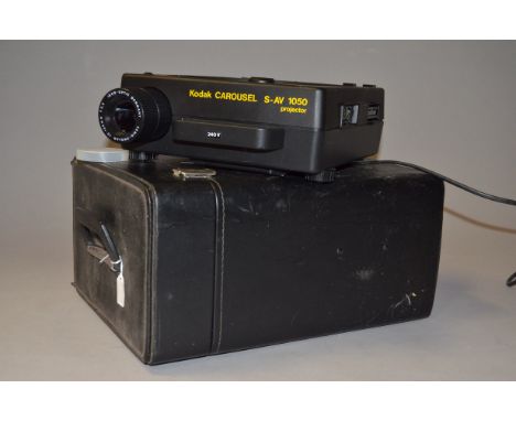 A Kodak Carousel S-AV 1050 Slide Projector, Type J, serial no N1468 2A with an Isco Vario-Projar 70-120mm f/3.5 lens, remote 