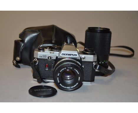 An Olympus OM10 SLR Camera and Accessories, serial no 259248, with Zuiko 50mm f/1.8 lens, maker's case, and a Prinzflex 80-20