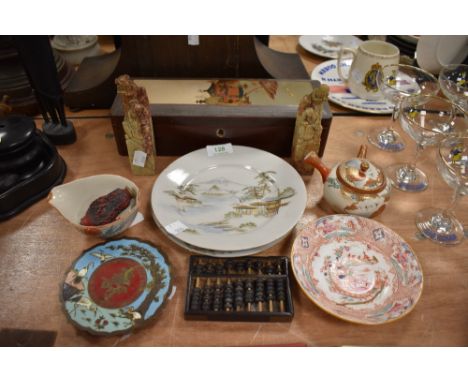 A selection of Chinese items including two soap stone figures two export plates and a cinnabar vessel bearing seal to base