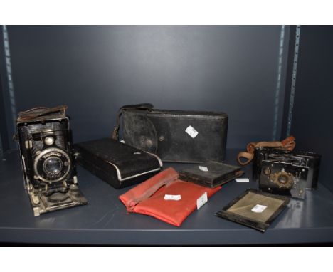 A selection of vintage cameras, including Vest pocket Kodak,Rollex vuiglander plate camera and more.