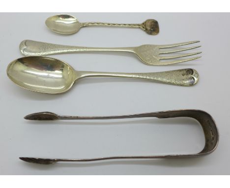 A pair of Scottish silver sugar bows, a Victorian silver spoon and fork and one other silver spoon, 131g 