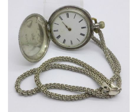 A lady's 935 silver full hunter fob watch, lacking glass and minute hand, on a silver chain 