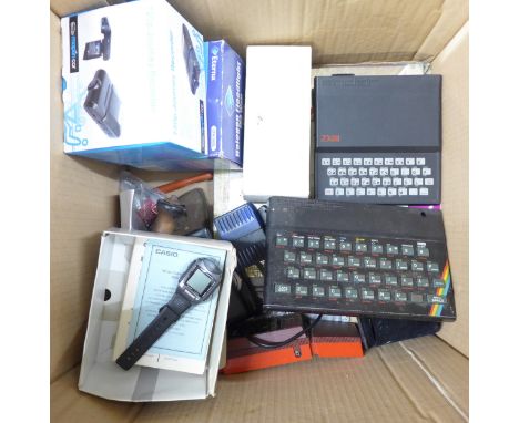 Two Sinclair 2X Spectrum computers, Casio wrist camera, Lumix digital camera, Palitoy Merlin hand held game, etc. **PLEASE NO