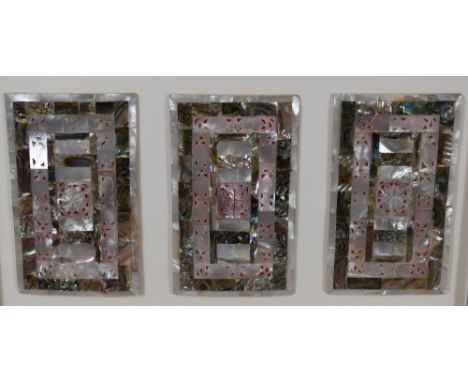A pair of mounted and framed Mother-of-Pearl and abalone shell triptych panels, reminiscent of Victorian visiting card cases,