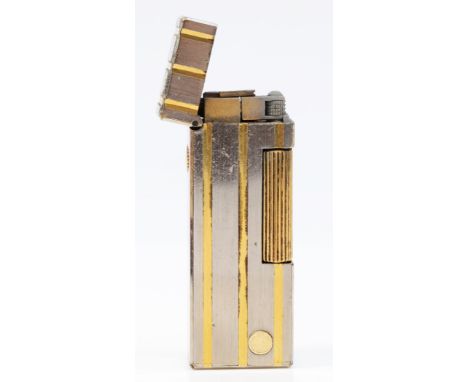 Dunhill, a stainless steel and gold plated rollagas lighter, no serial number, case