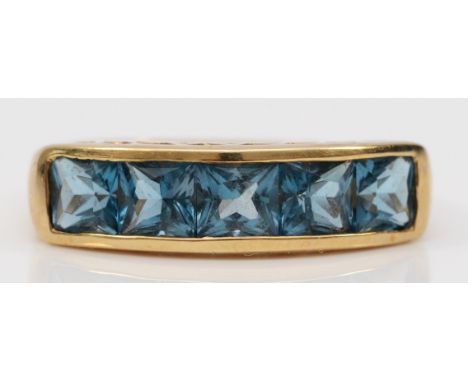 A 9ct gold square cut topaz five stone ring, channel set, M, 2.9g