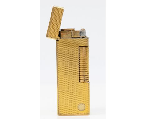 Dunhill, a gold plated rollagas lighter, no serial number, case and box.