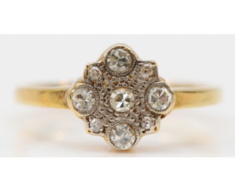 An unmarked 18ct gold five stone diamond ring, bezel setting, K 1/2, 3.2g