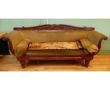 A Regency mahogany framed scroll arm sofa in the manner of William Trotter, the scrolling crest rail typically carved, above 