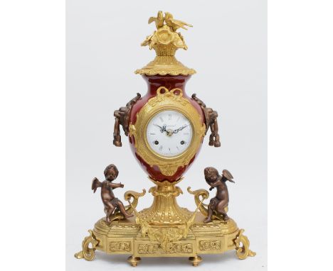 Imperial, an Italian large gilt brass, bronzed and burgundy urn mantel clock, with love birds in a nest finial, the German He
