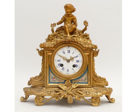 A French 19th century ormolu and porcelain panel mantel clock, the white enamel dial with blue Roman numerals and black Arabi