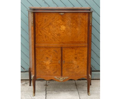 A French mahogany, kingwood and boxwood inlaid drinks cabinet, the fall front with mirrored interior, over two cupboard doors