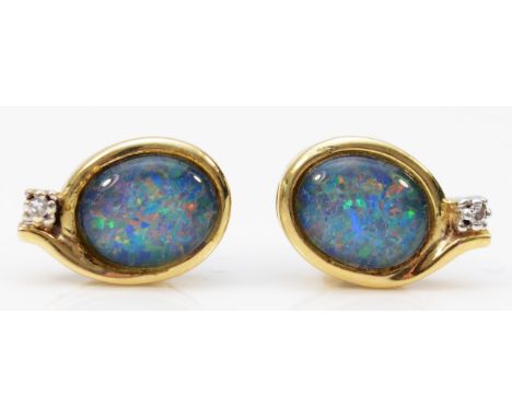 A pair of 14k gold diamond and opal triplet stud earrings with 9ct gold scroll backs, 10mm x 7mm opals, bezel set opal with a
