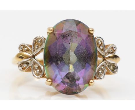 A 9ct gold mystic topaz and diamond dress ring, butterfly shaped diamond shoulders, 13mm x 10mm topaz, Birmingham, N, 4.2g