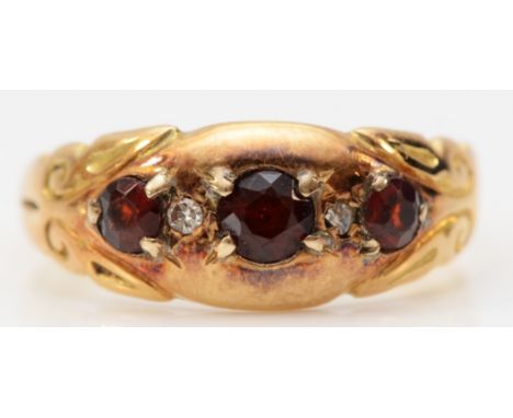 An 18ct gold garnet and diamond five stone ring, Chester 1915, maker H.W.Ld, N, 2.6g