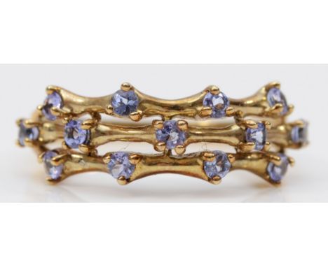 A 9ct gold tanzanite dress ring, claw set, three rows of tanzanite to the front of the ring, R, 2.9g