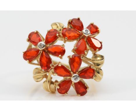 A 9ct gold fire opal and diamond floral dress ring, ring measures 23mm across the front, N, 4.9g