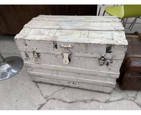 A DOMED TOP TRAVELLING TRUNK 