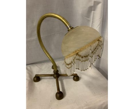 A BENSON BRASS TABLE LAMP WITH DECO GLASS SHADE AND FRINGE 