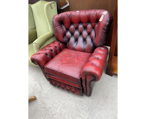 AN OXBLOOD BUTTON-BACK RECLINER CHAIR 
