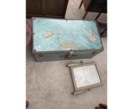 A METAL FRAMED TRAVEL TRUNK AND PAINTED MIRROR 