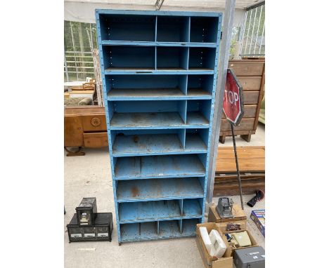 A 19 SECTION METAL PIGEON HOLE STORAGE UNIT 