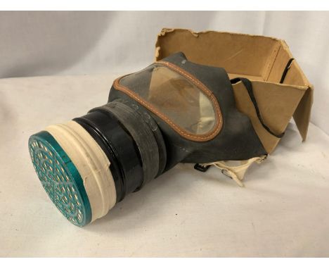 A GAS MASK WITH BOX 