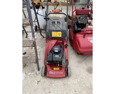 A MOUNTFIELD PETROL LAWN MOWER WITH GRASS BOX AND BRIGGS AND STRATTON ENGINE BELIEVED IN WORKING ORDER BUT NO WARRANTY 