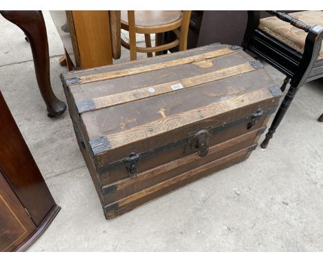 A 19TH CENTURY DOMED TOP TRAVELLING TRUNK WITH LOCK BY EAGLE LOCK CO, USA 