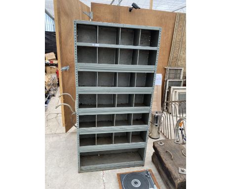 A 25 SECTION METAL PIGEON HOLE STORAGE UNIT 