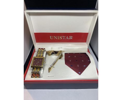 A BOXED UNISTAR SET TO INCLUDE A WATCH, CUFFLINKS. TIE AND TIE PIN 