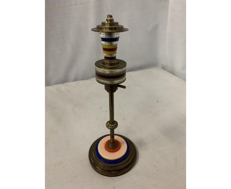 A BRASS PAPER WEIGHT - RAF LIGHT 