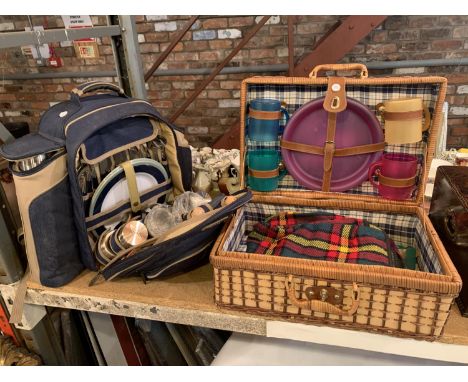 A WOVEN PICNIC HAMPER INCLUDING PLASTIC CUPS, PLATES AND A BLANKET AND A SECOND PICNIC RUCKSACK TO INCLUDE PLATES, CUTTLERY, 