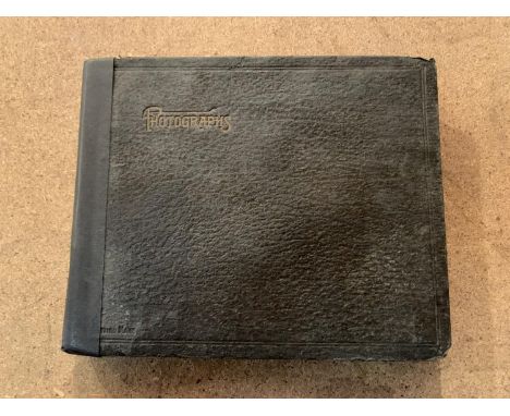 A SMALL VINTAGE PHOTO ALBUM CONTAINING BLACK AND WHITE IMAGES 