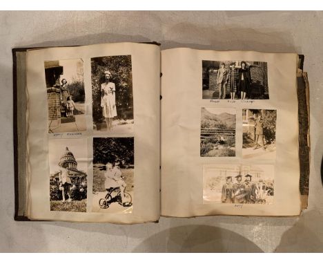 A VINTAGE PHOTO ALBUM OF VARIOUS BLACK AND WHITE PHOTOS 