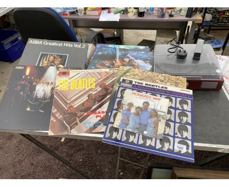 A RECORD PLAYER AND A LARGE QUANTITY OF RECORDS TO INCLUDE THE BEATLES, ABBA AND BONEY M 