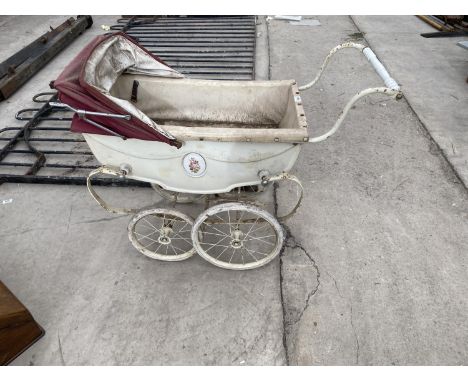 A VINTAGE SILVER CROSS PRAM 