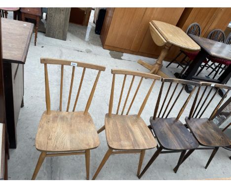 A SET OF FOUR ERCOL DINING CHAIRS WITH ELM SEATS AND COMB BACKS (TWO STAINED DARKER COLOUR) BEARING STAMP B.S.-K.L.-1960-2056