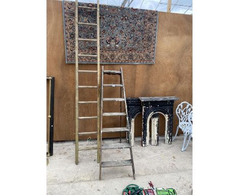 A VINTAGE 7 RUNG WOODEN STEP LADDER AND A A 12 RUNG WOODEN LADDER 