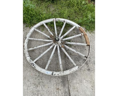A VINTAGE CART WHEEL WITH IRON RIM 