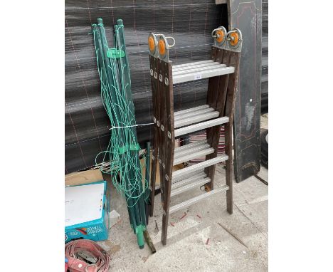 A LARGE FOLDING LADDER AND A WASHING LINE 