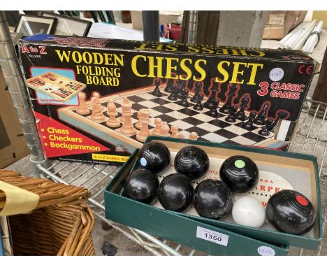 A FOLDING WOODEN CHESS SET AND A SET OF B&amp;A CARPET BOWLS 