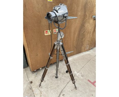 A RETRO STRAND ELECTRIC THEATRE LAMP ON A VINTAGE ARCHITECTS TRIPOD STAND 