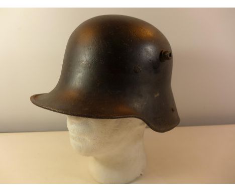 A WORLD WAR I IMPERIAL GERMAN PAINTED METAL HELMET, WITH LEATHER LINING 
