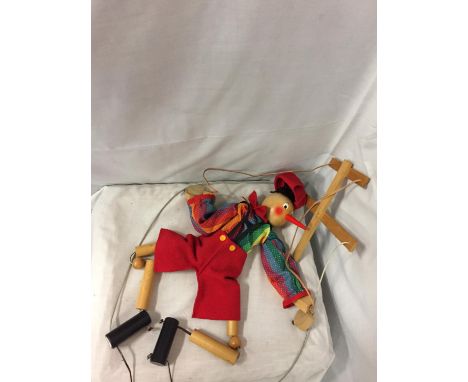 A WOODEN PINOCCHIO PUPPET 