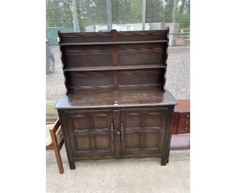 AN ERCOL STYLE DRESSER COMPLETE WITH PLATE RACK - 49" WIDE 