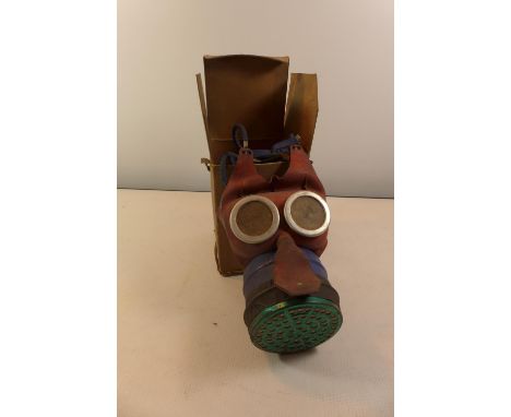 A WORLD WAR II CHILDS GAS MASK WITH BOX 